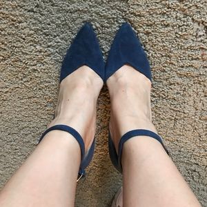 Navy blue suede pumps